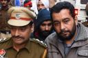 This photo taken on November 24, 2017 shows Jagtar Singh Johal (centre) being escorted to a court in Ludhiana in India's northern Punjab state