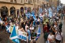 Pro-independence supporters march down the Royal Mile