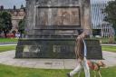 A slavery plaque which has sparked debate was removed from a statue in St Andrew's Square