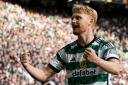 Liam Scales celebrates a Celtic goal at Parkhead