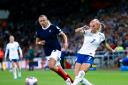 England's Chloe Kelly (right) and Scotland's Claire Emslie battle for the ball during the UEFA Women's Nations League Group A1 match at the Stadium of Light, Sunderland