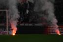 Flares were thrown on to the pitch