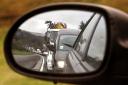 A traffic jam pictured in the wing mirror of a car on the A9