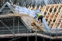 File photo dated 28/02/12 of a roof worker building new houses, as growth in workloads across the Scottish construction sector stalled during the last quarter, a report has found. PRESS ASSOCIATION Photo. Issue date: Thursday July 28, 2016. See PA story