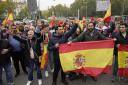 People protest against the investiture debate a day before the Socialist leader seeks the endorsement of the chamber to form a new government at the nearby Spanish Parliament in Madrid Spain, Wednesday, Nov. 15, 2023. Demonstrators are protesting