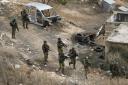 Israeli soldiers are seen during a military operation in the Balata refugee camp, West Bank