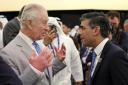King Charles speaks with Rishi Sunak at the COP28 climate summit in Dubai