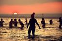 Several hundred swimmers took a sunrise dip in the North Sea at Portobello Beach