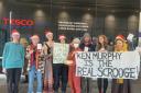Activists held a 'Christmas party' in the Tesco Bank offices in Glasgow