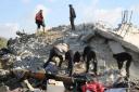 Palestinians look for survivors following air strikes on Rafah