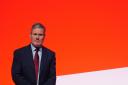 Keir Starmer speaks in front of a huge Union flag at his party's conference