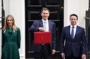 Chancellor Jeremy Hunt standing in Downing Street ahead of the Spring Budget