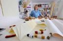 Charlene Scott, 52, in her studio at home with some of her work