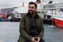 Humza Yousaf beside the ferry in Ullapool
