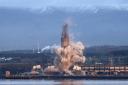 The 600 foot high chimney stack at Longannet Power Station in Fife in a controlled explosion