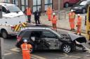 A black Suzuki car is pulled from the tracks after being hit by a train at Redcar Central station on Wednesday (May 1).