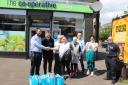 Co-op staff hand over the donation to Headwell Community Council chairperson Aileen Farlam.