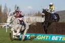 Smad Place clears the last ahead of the 2015 Grand National winner Many Clouds. Picture: Julian Herbert/PA