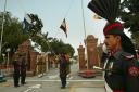 India and Pakistan's flags are lowered during a ceremony at the border crossing between the countries at Wagah in 2004