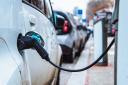 Electric vehicle drivers in Scotland face paying charges to top up, a new report has said