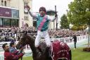 Frankie Dettori celebrates his fifth Prix de l'Arc de Triomphe victory with a flying dismount from Enable