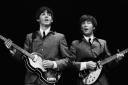 Omega Auctions handout photo of Paul McCartney (left) and John Lennon, one of a series of shots of The Beatles' first US concert tour expected to sell for £250,000 at auction