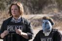 Melissa McCarthy as Detective Connie Edwards and Phil Philips (voiced by Bill Barretta) in The Happytime Murders