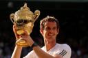 Andy Murray shows off the trophy after winning Wimbledon in 2013