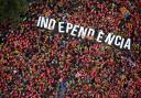 Independence supporters form the word 'independence' during Catalonia's National Day in Barcelona, 2018