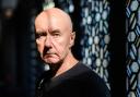 In this picture taken on November 8, 2018, Scottish novelist Irvine Welsh poses during an interview with AFP in Hong Kong. - Twenty-five years ago Irvine Welsh's debut novel 