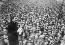 Irish revolutionary leader Eamon de Valera, reading from notes, addresses a huge crowd of Dubliners during his years as Prime Minister of Ireland