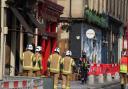 Firefighters continue to tackle blaze that damaged 'Harry Potter' cafe