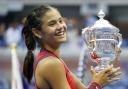 Emma Raducanu holds the trophy as she celebrates winning the women's singles final on day twelve of the US Open