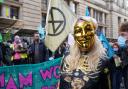 Climate activists stage a 'Trillion Dollar Bash' outside the offices of JP Morgan on Waterloo Street, Glasgow