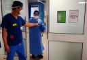 Medical staff wearing PPE on a ward for Covid patients. Photo: PA