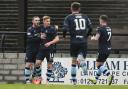 Morton's Gavin Reilly (second from left) celebrates with his team-mates