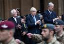 Boris Johnson (centre) applauds military staff who took part in the Operation Pitting evacuation of Kabul
