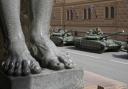 In advance of the Victory Day military parade taking place tomorrow, soldiers have been preparing their Russian T-72 tanks by the feet of a famous sculpture of Atlas at the State Hermitage museum in St Petersburg