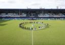 Players from Grenfell AFC and the Emergency Services team observed a minute's silence ahead of a game at the Grenfell Memorial Cup at Kiyan Prince Foundation Stadium in White City, London on May 21