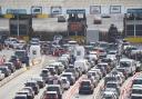 Cars queue at the check-in at the Port of Dover in Kent as many families embark on getaways following the start of summer holidays in England