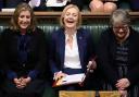 Penny Mordaunt, left, sits alongside Liz Truss and Therese Coffey in the Commons