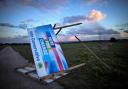 A Conservative election billboard is blown over in high winds