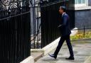 Rishi Sunak walks to the door of 10 Downing Street