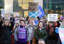 Activists gathered outside the UK Government building in Edinburgh during a protest against Section 35