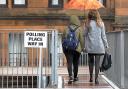 Voters arrive at Notre Dame Primary School set up as a polling station in Glasgow