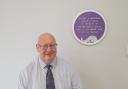 Andy Doig next to the plaque in Lochwinnoch dedicated to former SNP president Roland Muirhead