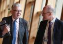 John Swinney and Michael Russell in the Scottish Parliament