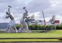 The 'Shipbuilders of Port Glasgow' sculpture alongside the Ferguson Marine shipyard in Port Glasgow, Inverclyde.
