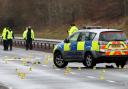 Tayside Police investigation team search the southbound carriageway of the A9 near Auchterarder