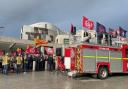 Members of the Fire Brigades Union and their supporters take part in a demonstration outside the Scottish Parliament